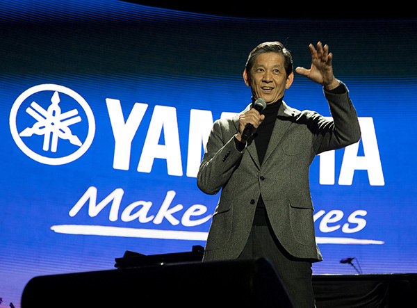 [ image ] Takuya Nakata, Yamaha President and Representative Executive Officer, speaking at the NAMM concert